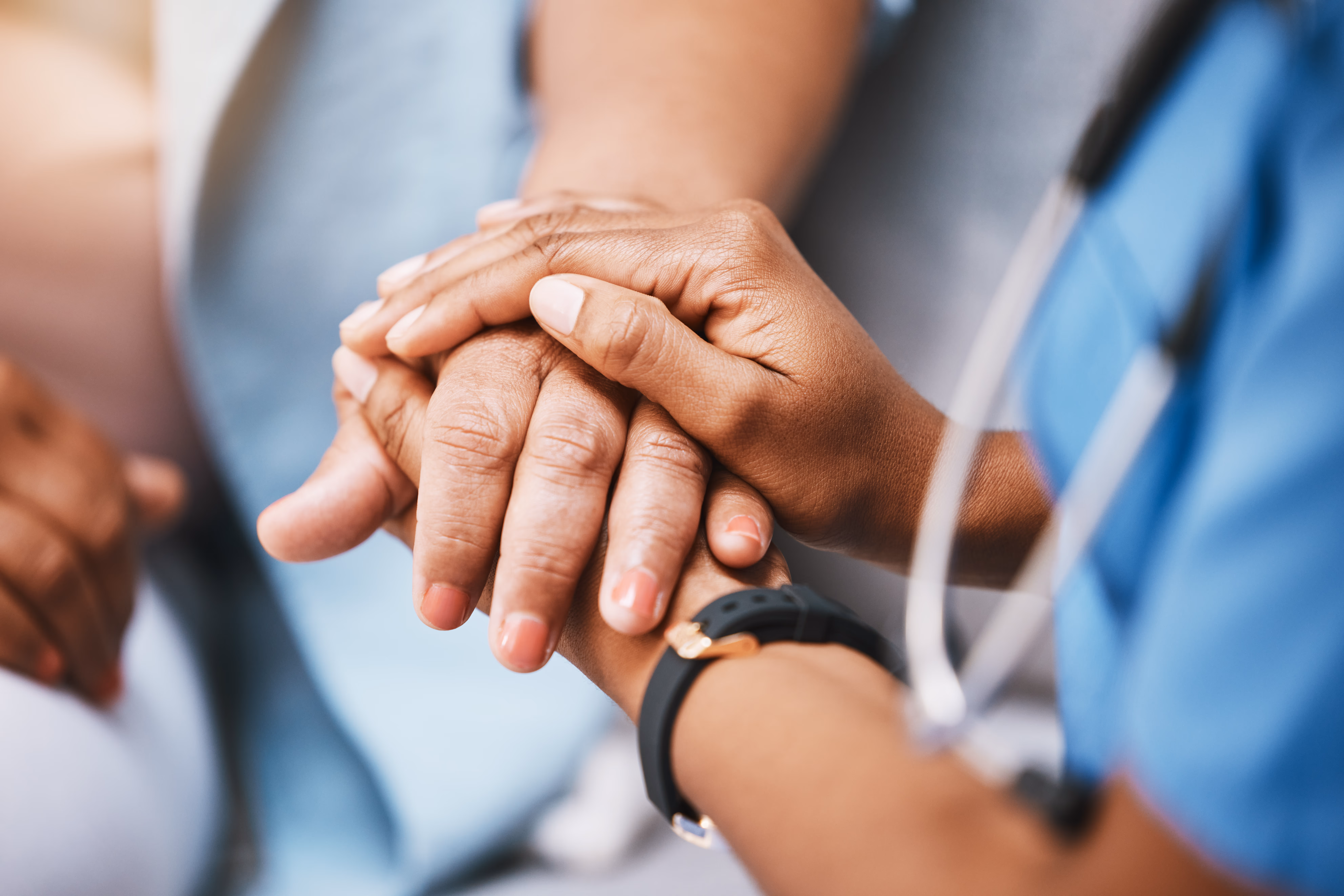 Hands working together at a table